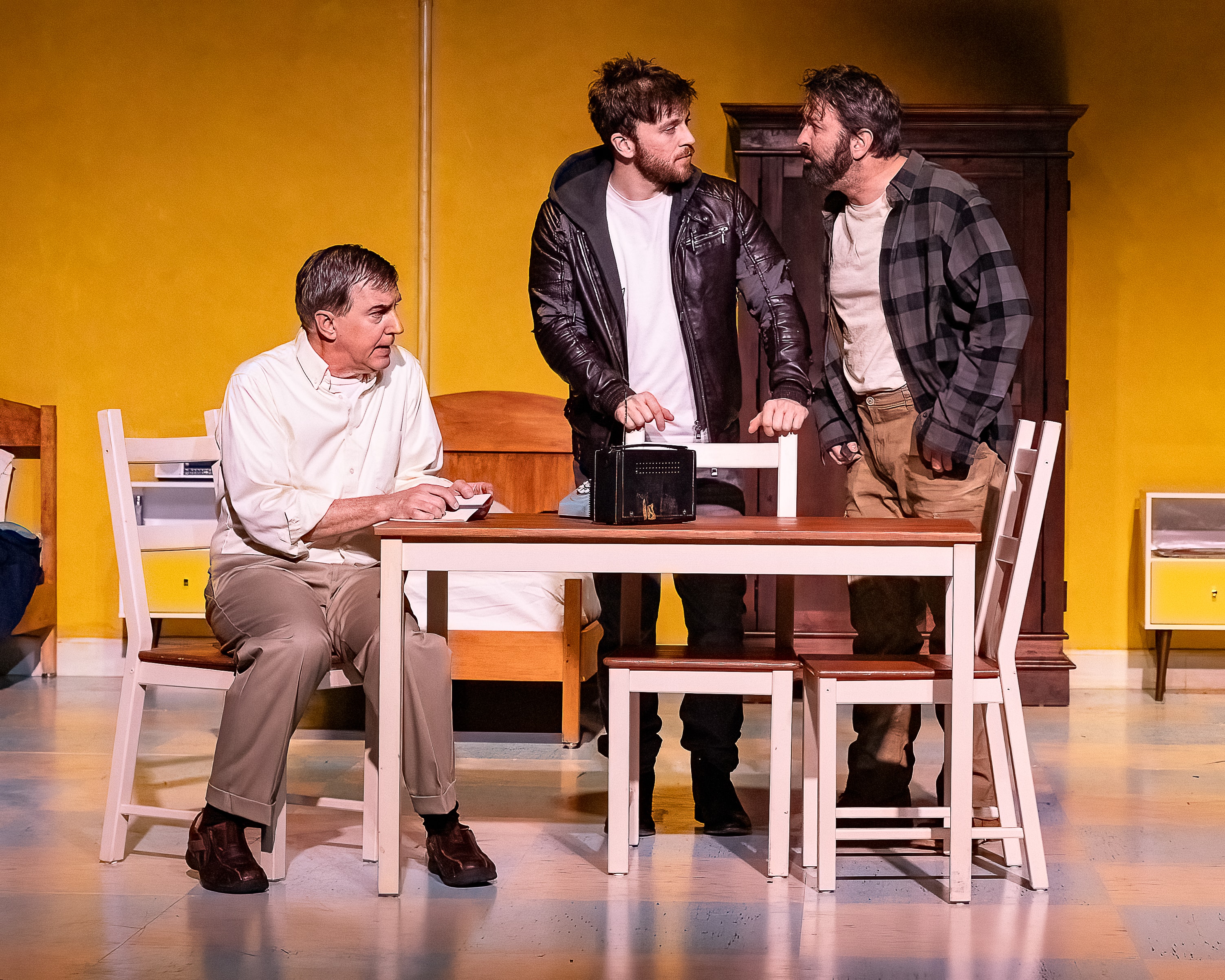 Elling 2023 — three men conversing on theater stage