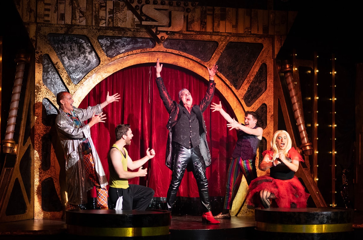 Saucy Jack and the Space Vixens 2022 — circus performers on stage with red curtain